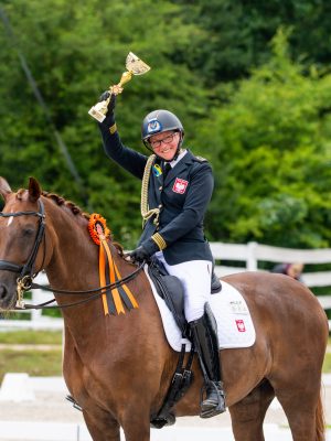 SKOWRONSKA-KOZUBIK Zaneta
(POL) celebrating during prize giving at the FEI Dressage Olympic Qualifier - Group C - pc FEI/Łukasz Kowalski